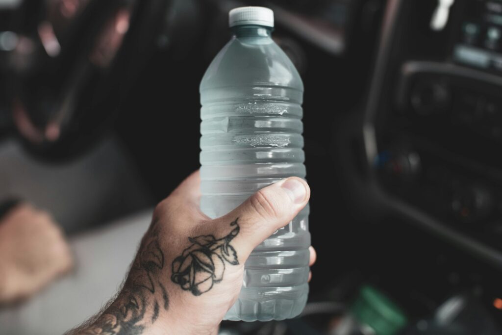 hand holding a bottle of water for hydration